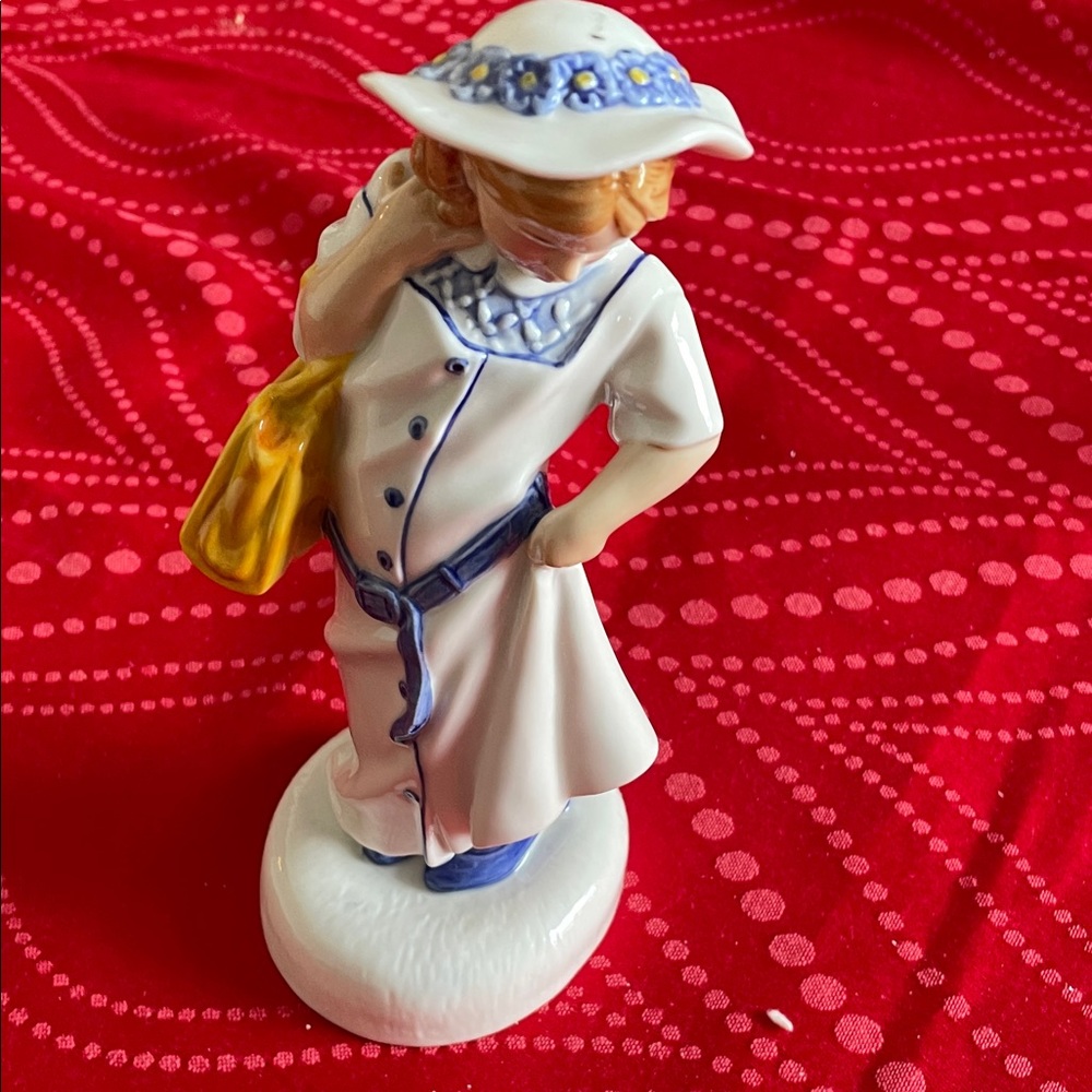 Royal Doulton Figurine with Blue and Yellow Accents childhood days